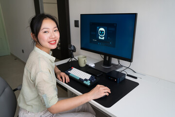 Young professional using robot assistant in home office