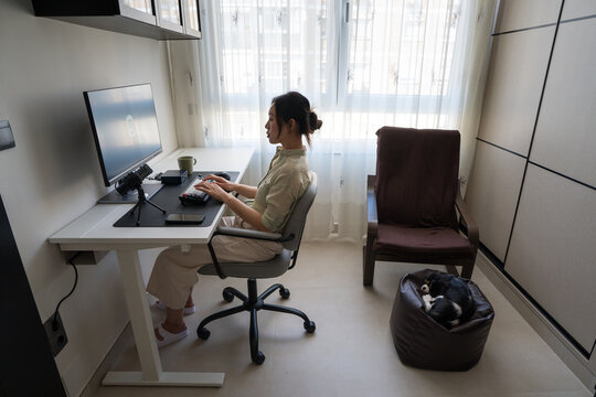 Young professional using robot assistant for daily tasks