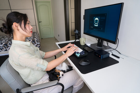 Young professional using robot assistant for daily tasks