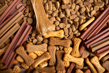 Dry dog food. Biscuit bones and crunchy organic kibble pieces for dog feed.
