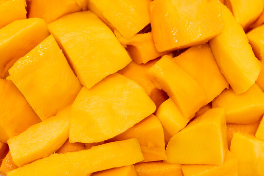 Close up of fresh mangoes showcasing vibrant texture