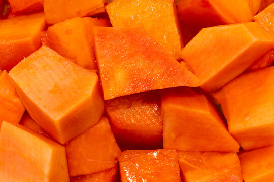 Close up of fresh papaya texture showcasing vibrant color