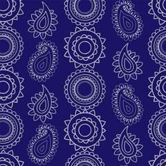 indian seamless pattern with silver mandala circles and paisley motifs on a dark blue background for luxury festive designs and textiles
