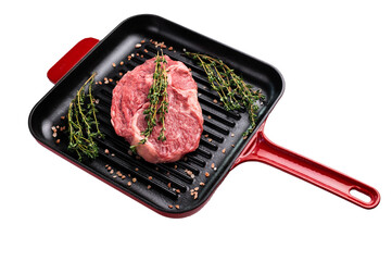 Raw Rib eye steak in a skillet, marbled prime beef meat isolated on white background