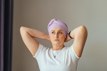 Strong woman finalizing turban with determined look