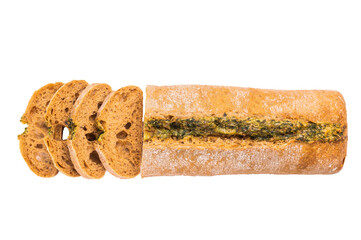 Sliced Garlic bread with herbs on table isolated on white background