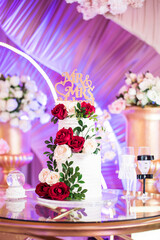Wedding Cake in Front of Wedding Stage on a Cake Stand