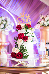 Wedding Cake in Front of Wedding Stage on a Cake Stand