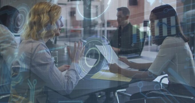 Blonde consultant pointing to report, activating holographic charts driving business collaboration