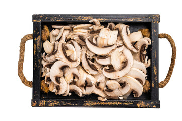 Sliced raw champignons Mushrooms in a kitchen tray isolated on white background.