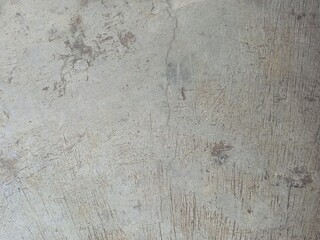 Distressed Gray Concrete Surface with Scratches and Cracks