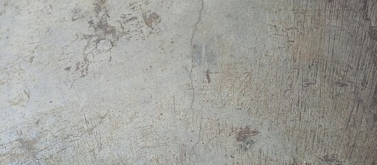 Distressed Gray Concrete Surface with Scratches and Cracks