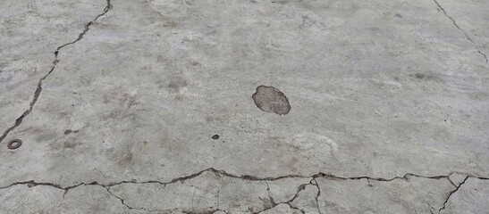 Extensive Cracks and Pitting on Distressed Concrete Floor