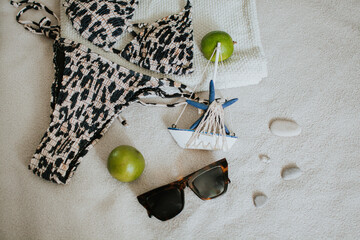 Leopard swimsuit, towel, slippers, glasses and other things for a seaside vacation