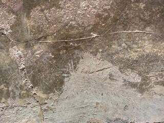Heavily Damaged and Scratched Concrete Surface with Debris