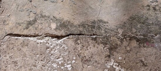 Fototapeta premium Heavily Cracked and Damaged Concrete Ground Surface