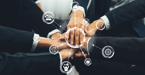 Office worker team stacking hand together symbolize successful group of business partnership and...