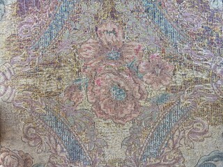 Intricate Floral Pattern on Worn Fabric Tapestry