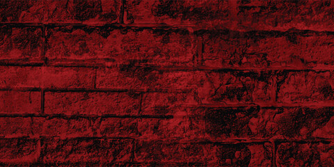 Monochrome red photograph of a stone wall, emphasizing its form, shadows, and the interplay of light on its rugged surface.
