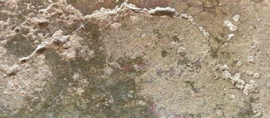 Severely Deteriorated Concrete Surface with Flaking and Stains