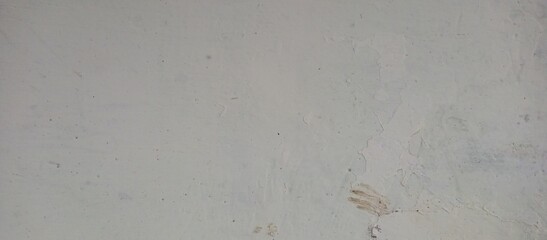 Subtly Textured Light Grey Wall with Peeling Paint and Stains