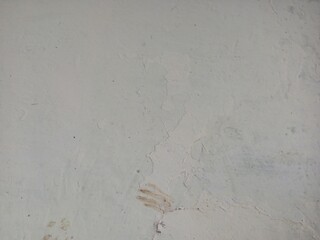 Subtly Textured Light Grey Wall with Peeling Paint and Stains