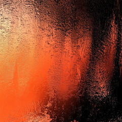 Abstract textured gradient of orange and black providing a striking visual background
