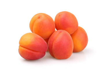 A pile of ripe apricots isolated on a white background