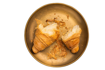 Broken fresh baked French croissant  isolated on white background.