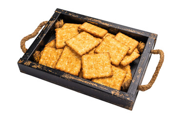 Square salty crackers in wooden tray isolated on white background, top view