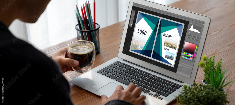 Poster graphic designer software for modern design of web page and commercial ads showing on the computer s