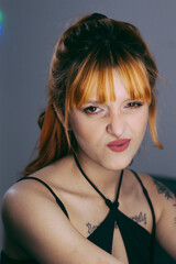 portrait of a young woman pulling a face