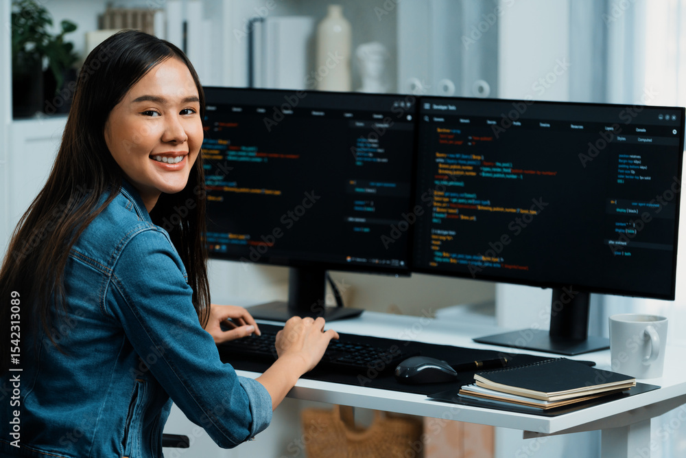 Poster young asian in it developer looking at camera to present with online information on pc with coding p