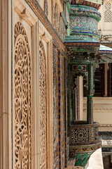 Intricate jali carvings and colorful tilework adorning City Palace, Udaipur, India