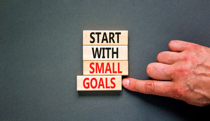 Start with small goals symbol. Concept words phrase Start with small goals on beautiful wooden...