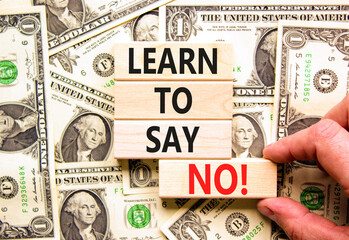 Learn to say no symbol. Concept words phrase Learn to say no on beautiful wooden blocks. Dollar...