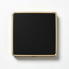 Fototapeta premium A minimalist square object with a black interior and a golden trim on a white background with soft lighting.