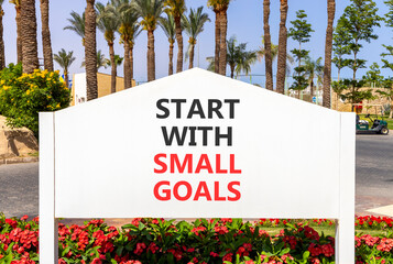 Start with small goals symbol. Concept words phrase Start with small goals on beautiful white road...