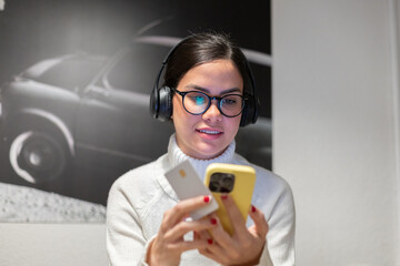 Smiling woman making mobile payment with credit card.