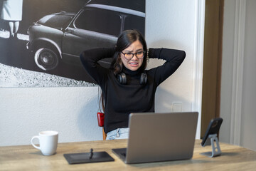Frustrated woman reacting to her laptop screen while working remotely.