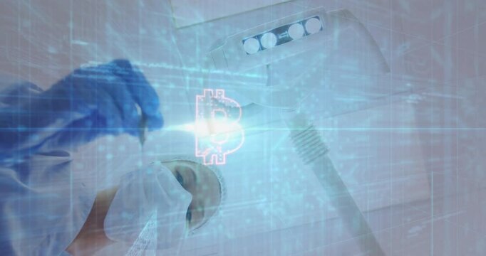 Surgeon adjusting lamp while code drifting in health tech and bitcoin hologram pulsing above hand - Powered by Adobe