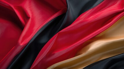 Luxury fashion-inspired abstract background with dramatic folds of fabric in bold red, gold, and black, sharp lighting, shadows creating depth