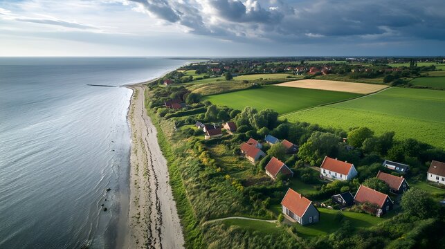 Panoramic view of the peaceful countryside around Ribe with farmhouses and green fields, Denmark