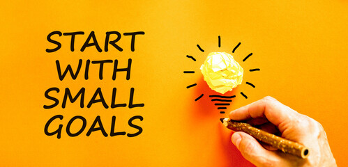 Start with small goals symbol. Concept words phrase Start with small goals on beautiful paper....
