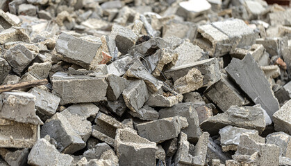 Pile of gray concrete debris from demolished building