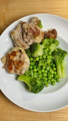 Plate of fresh and healthy food with vegetables, greens and protein. Health, dieting, wellness, and clean eating concept, suitable for nutrition, diet, lifestyle, and culinary-themed purposes.