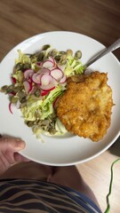 Well-balanced breakfast featuring healthy source of ptotein, fermented and fresh vegetables, salad and nuts on a plate. Top view real kitchen photo, diet and self care and love concept