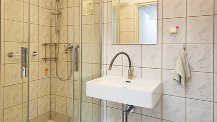 Interior of a bathroom with toilets. Design of sanitary facilities for personal care. Personal hygiene in public places. Ceramic products in everyday life.