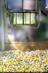 Old popcorn machine for making popcorn in the park. Children's corn attraction. Making healthy food.