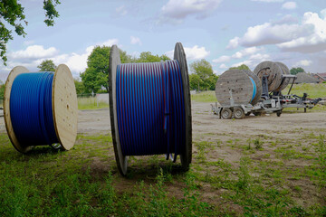 Laying fiber optic cables in the ground, underground cables for faster Internet in a new...